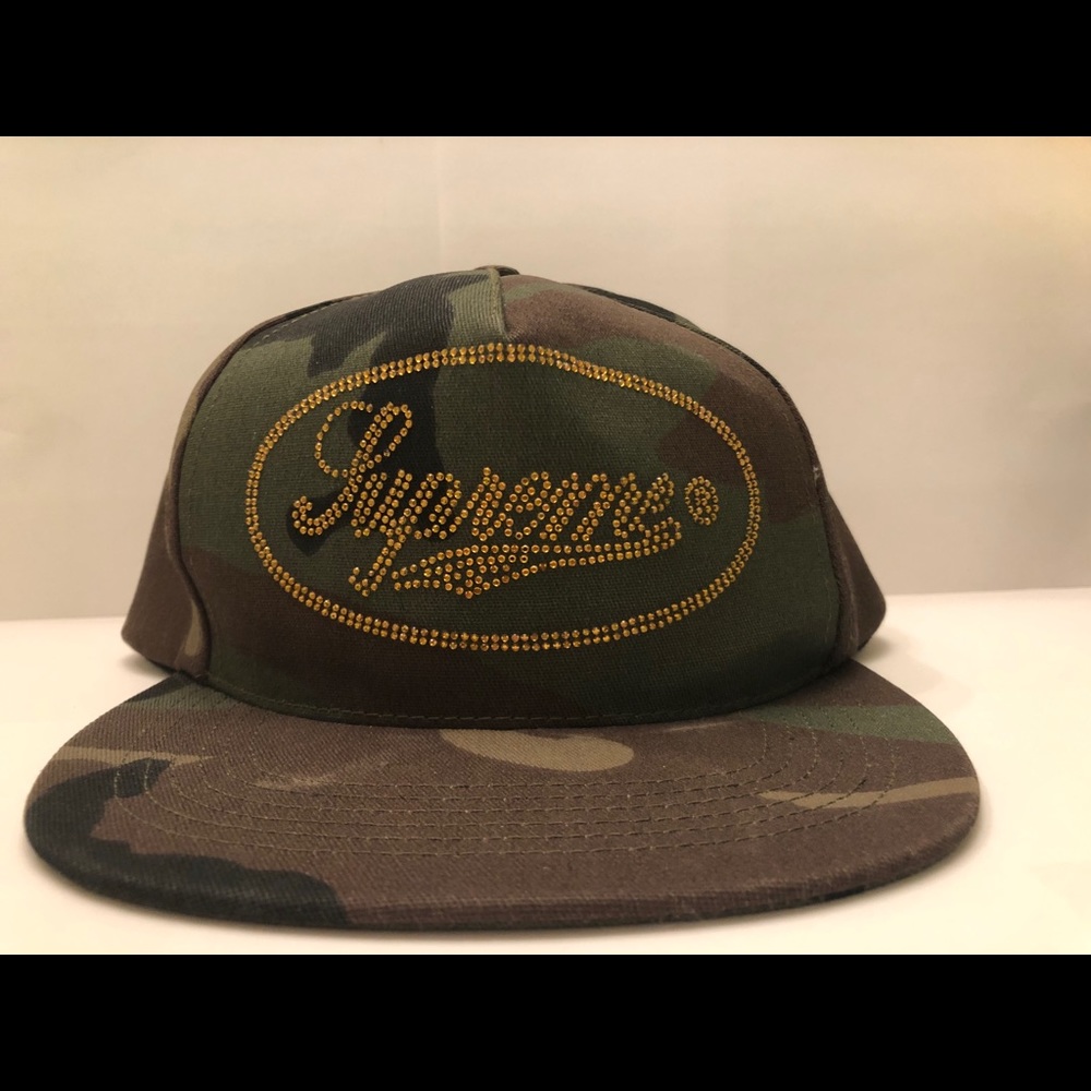 Supreme camouflage hat with rhinestone emblem